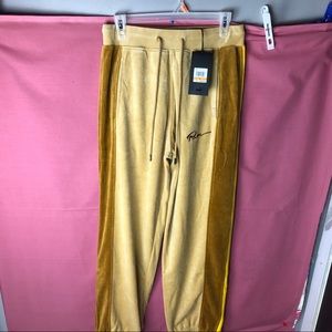 puma track shorts yellow